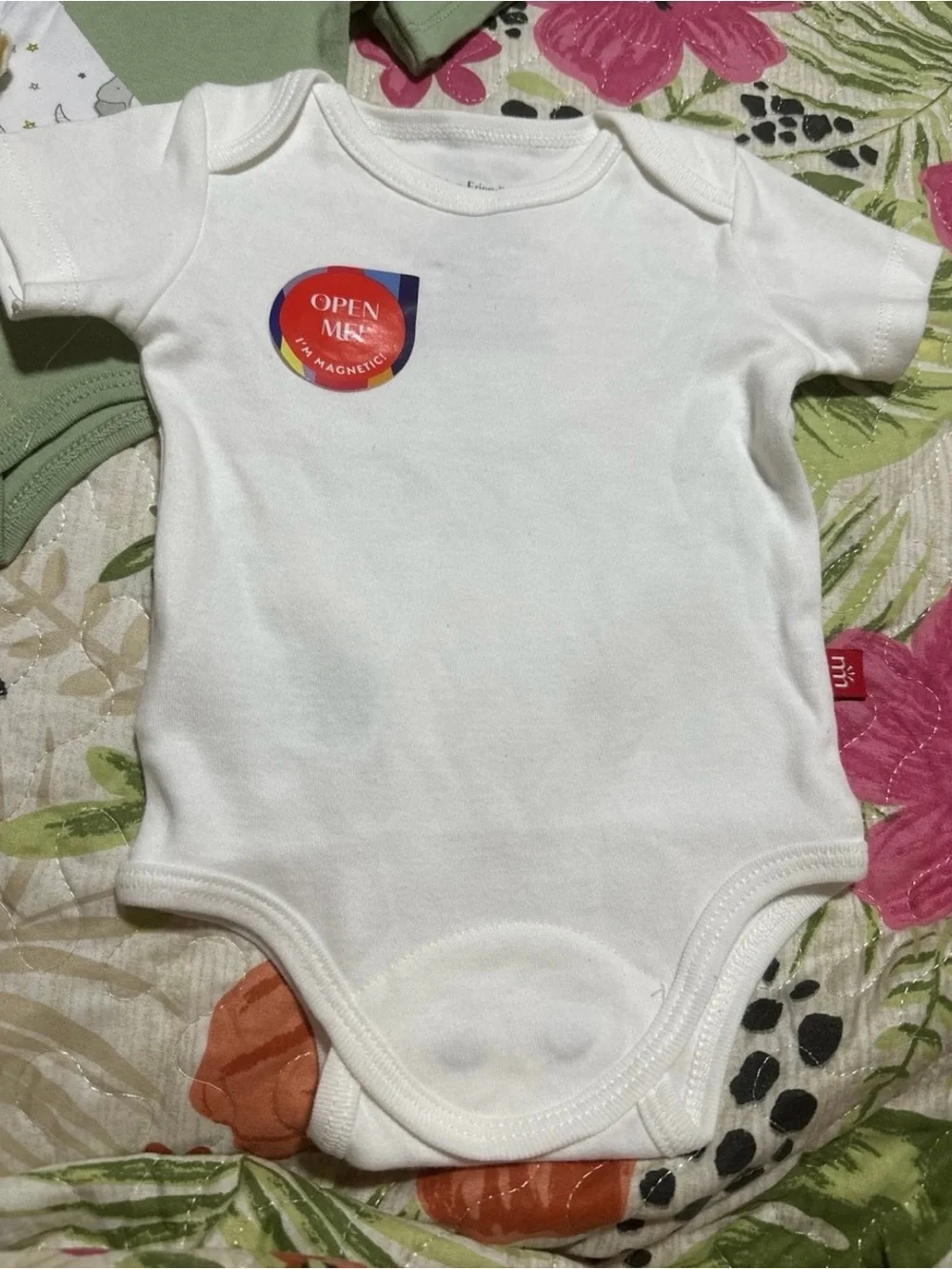 Magnetic Me Baby One-Piece Bodysuits in Sage, Cream, White, and Moon Print Newbo